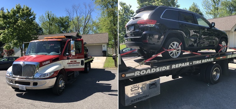 Jeep being towed on rollback tow truck